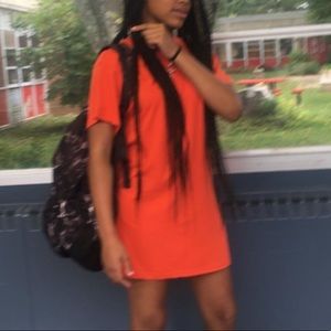 Bright orange tee shirt dress.